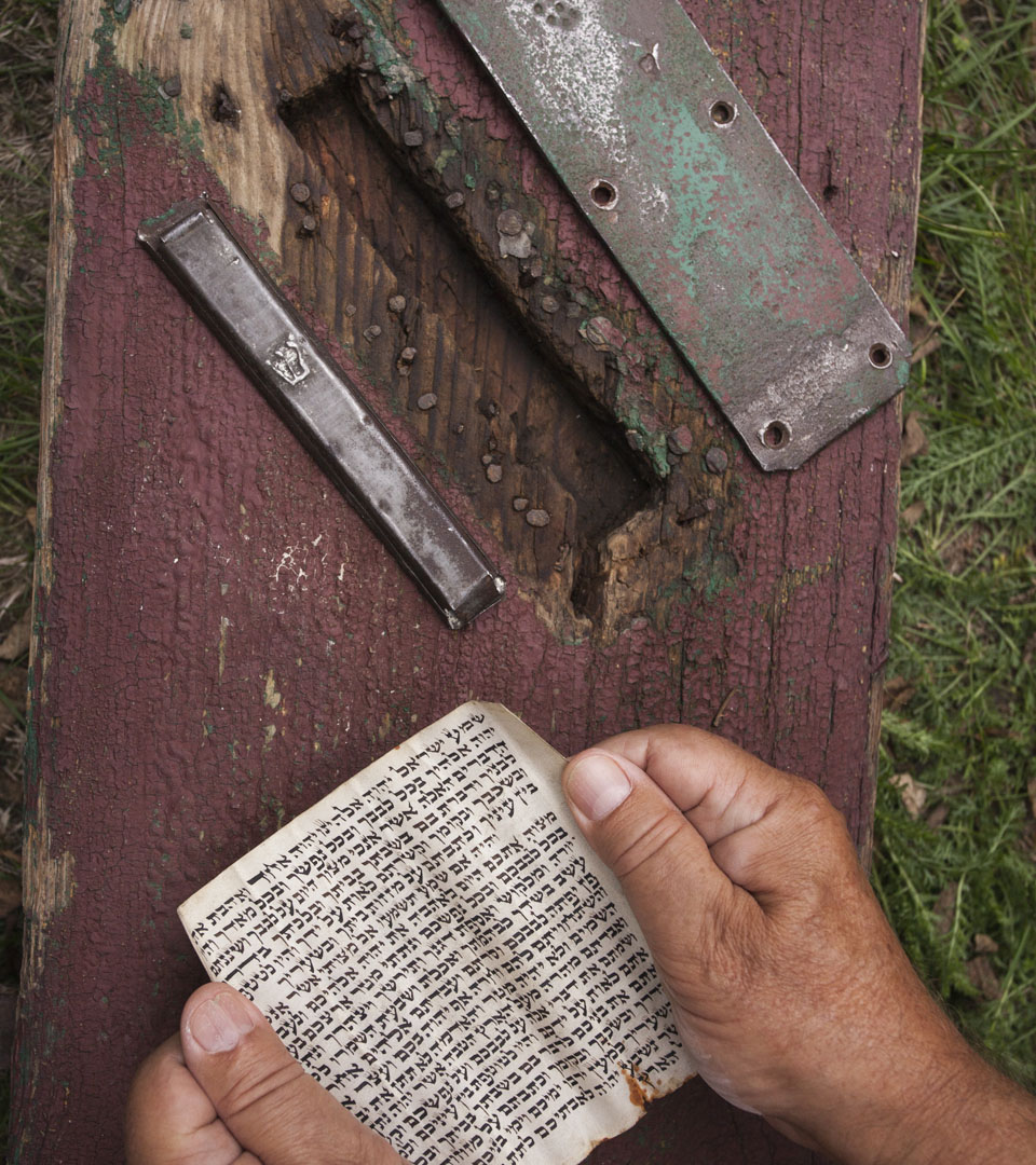 Original mezuzah case and the mezuzah scroll found in Żarki