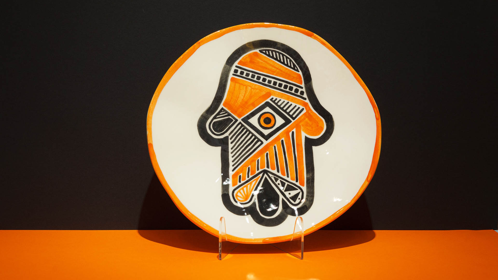 Hamsa: Jewish symbol hand-painted in black and orange. Jewish gift plate.