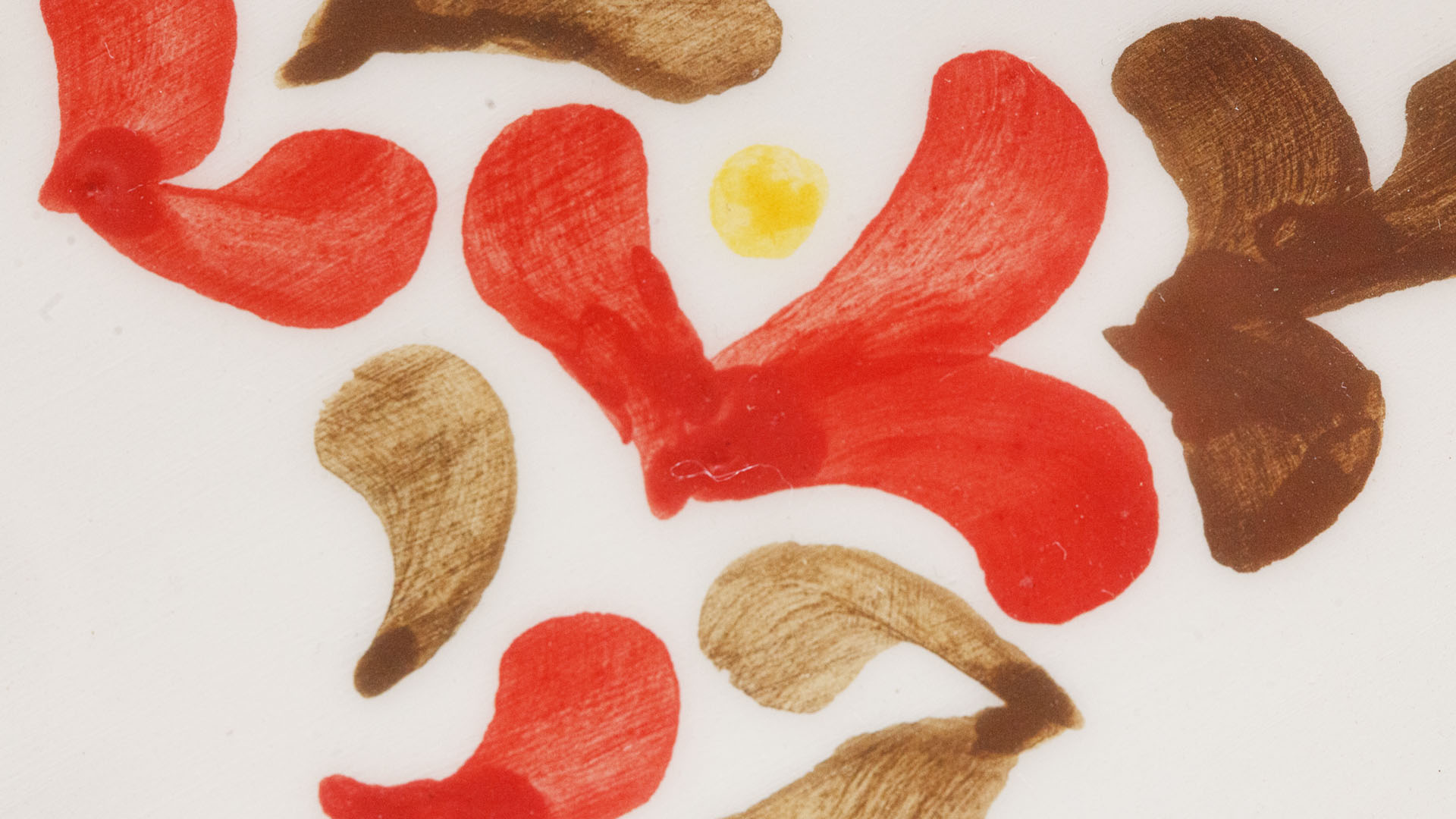 A close-up of a hand-painted plate with a Star of David Jewish plate. Hand-painted Jewish Judaica. Brushstrokes and ceramic glaze are visible. Highly precise craftsmanship.