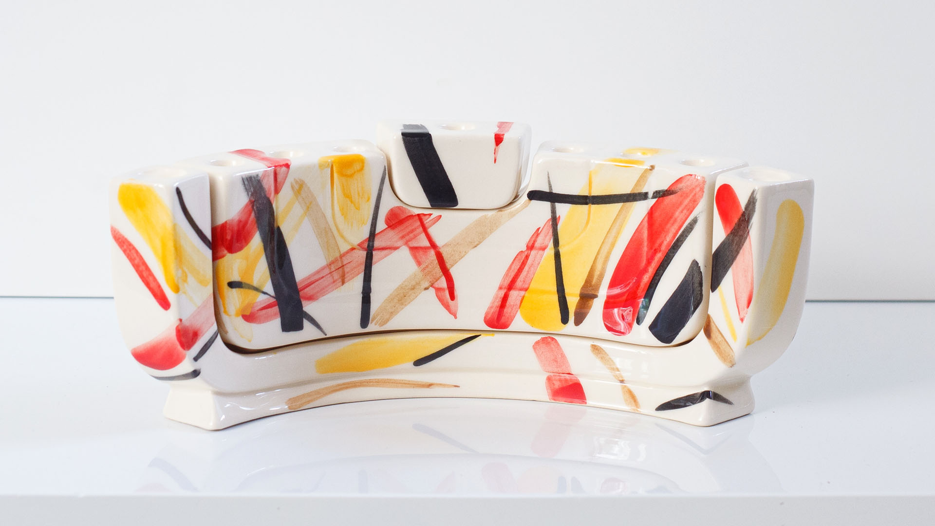 Jewish menorah called the MENOKIAH. Designed by MI POLIN, this stylish menorah combines two Jewish candlesticks: the menorah and a two-branched Shabbat candlestick. Together, these elements form a Hanukkah menorah. This is our interpretation of Jewish tradition! For this reason, Menokiah can be used every week on Shabbat and once a year on Hanukkah