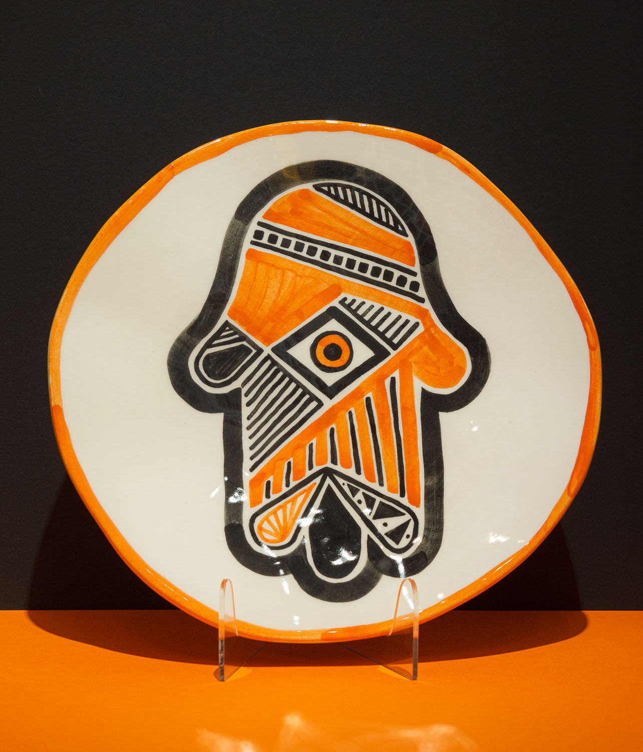 The round Seder plate is an example of contemporary Jewish art. Jewish motifs such as the menorah, Star of David, and Hamsa were hand-painted by Helena Czernek and Aleksander Prugar of MI POLIN. Contemporary, hand-painted Judaica. Each plate is like a painting and exists in a single copy.