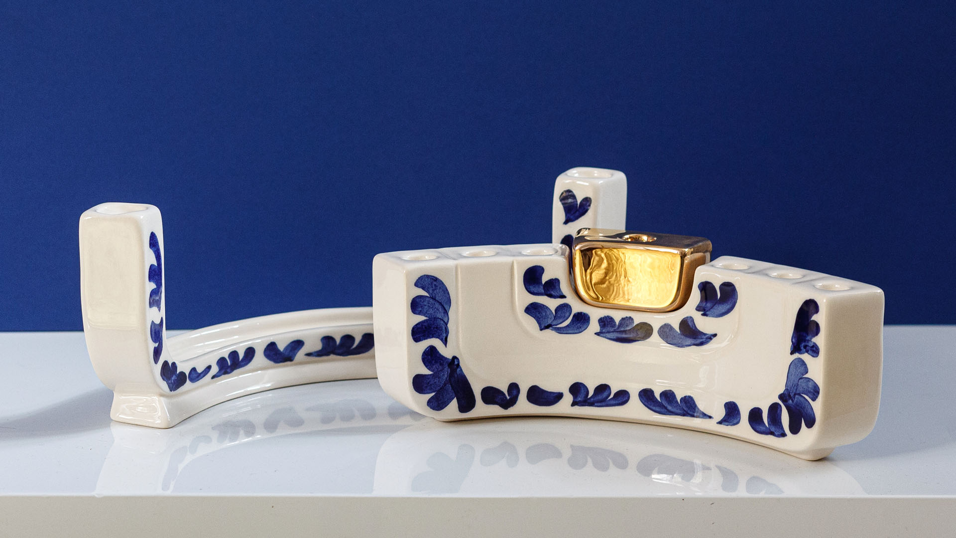 Jewish menorah called the MENOKIAH. Designed by MI POLIN, this stylish menorah combines two Jewish candlesticks: the menorah and a two-branched Shabbat candlestick. Together, these elements form a Hanukkah menorah. This is our interpretation of Jewish tradition! For this reason, Menokiah can be used every week on Shabbat and once a year on Hanukkah