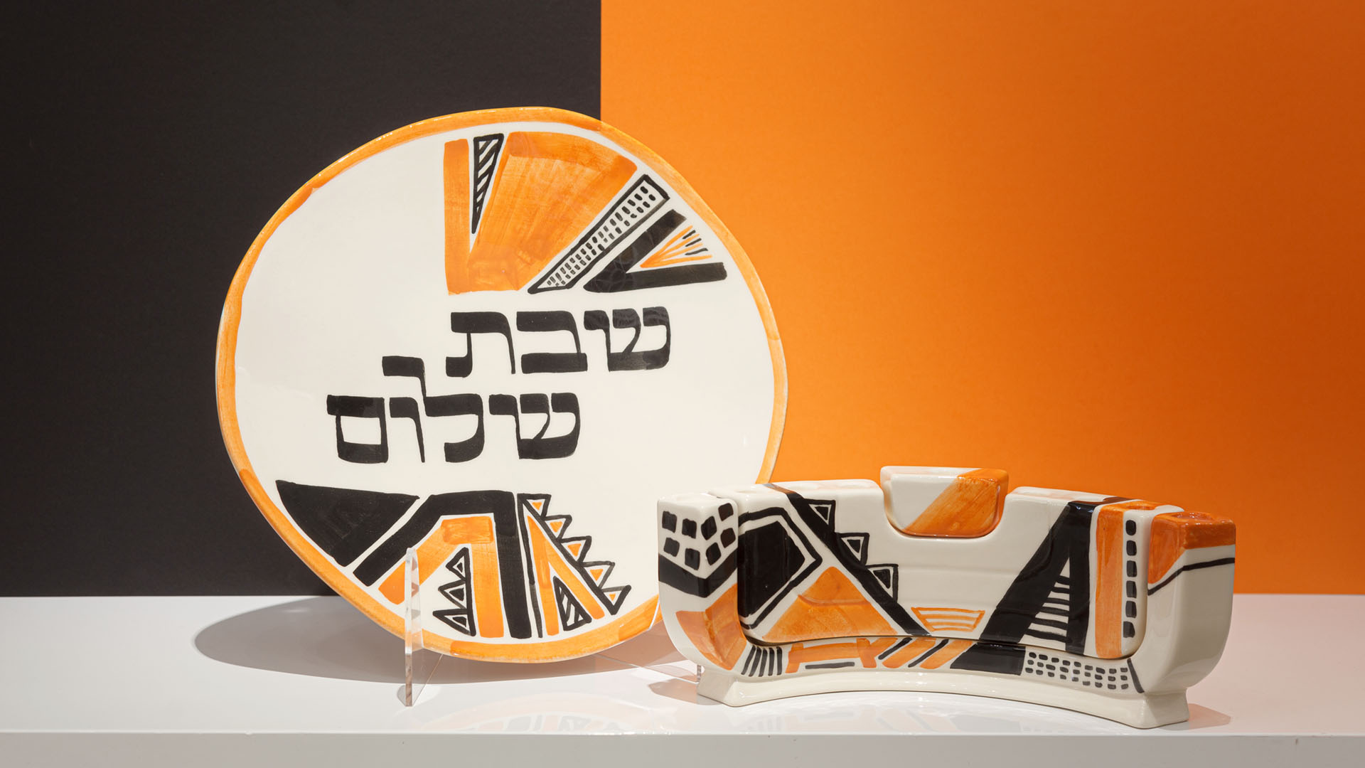 The Menokiah is a custom menorah designed by MI POLIN. It combines three traditional Jewish candlesticks: a two-arm Shabbat candlestick, a Hanukkah, and a menorah.