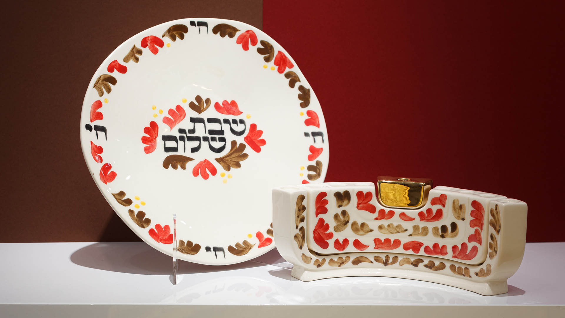 The Menokiah is a custom menorah designed by MI POLIN. It combines three traditional Jewish candlesticks: a two-arm Shabbat candlestick, a Hanukkah, and a menorah.